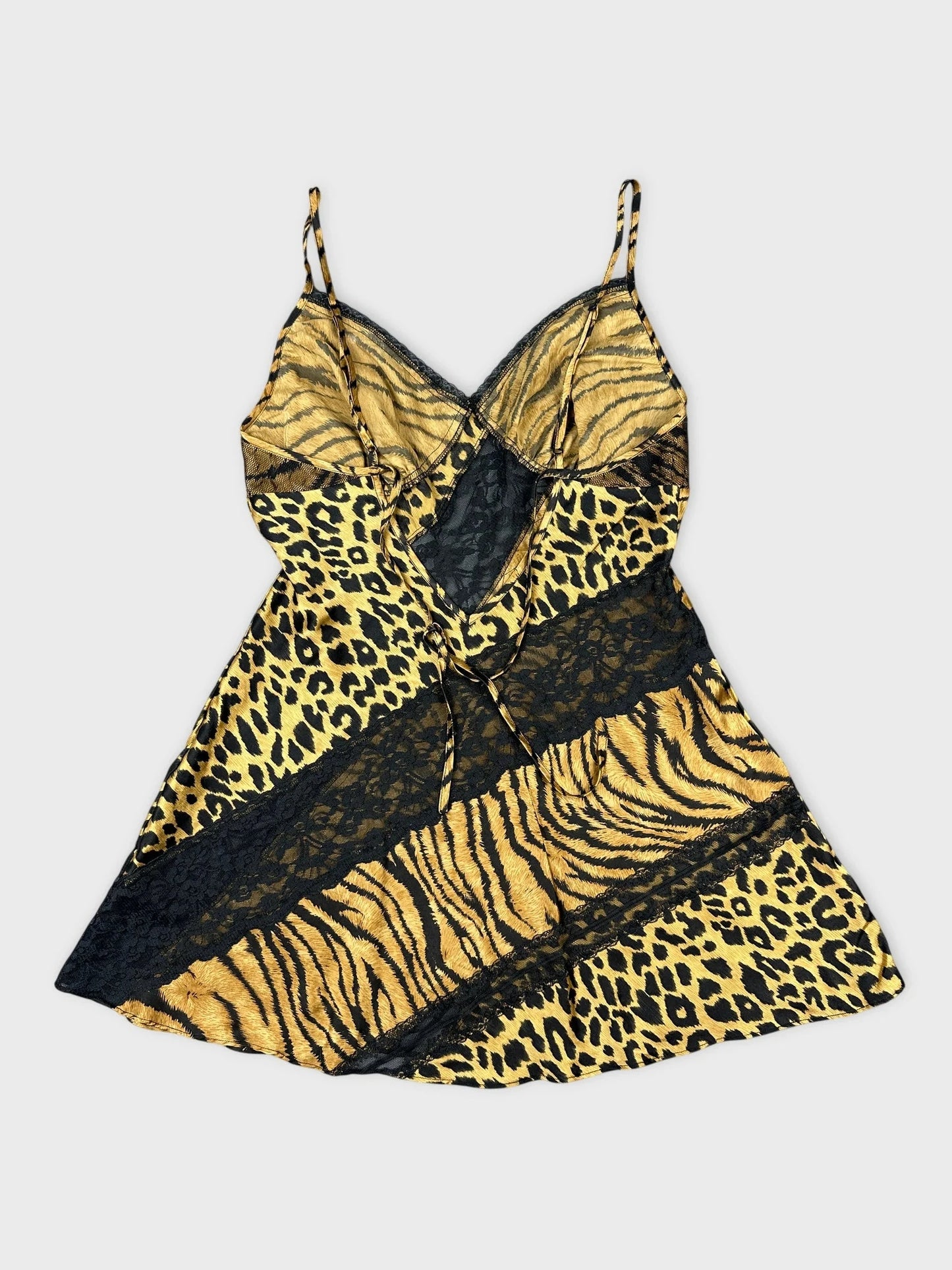 Back view of a silk animal print camisole featuring black lace detail.