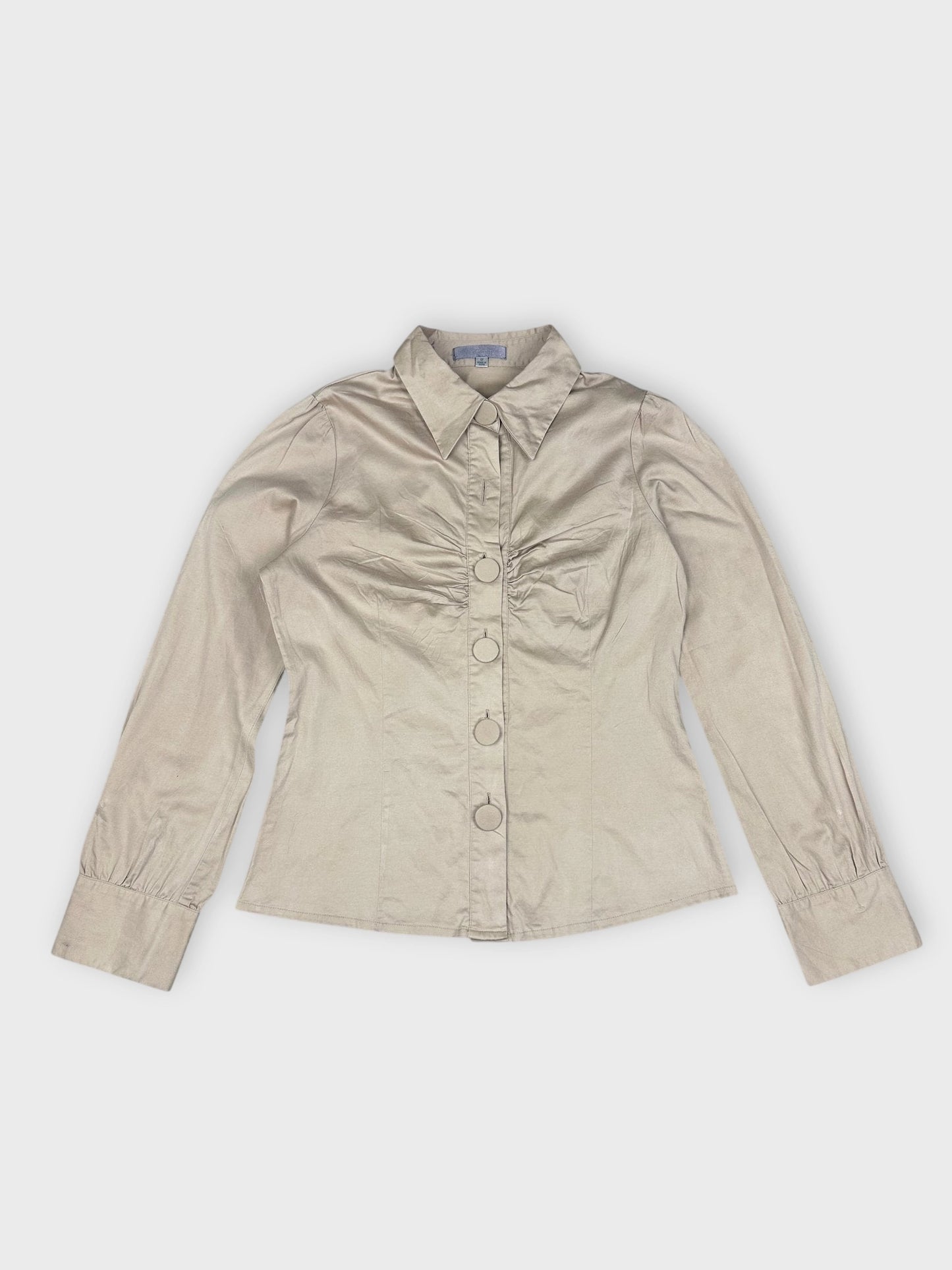 Beige button-up blouse with ruched bust detail, front view.