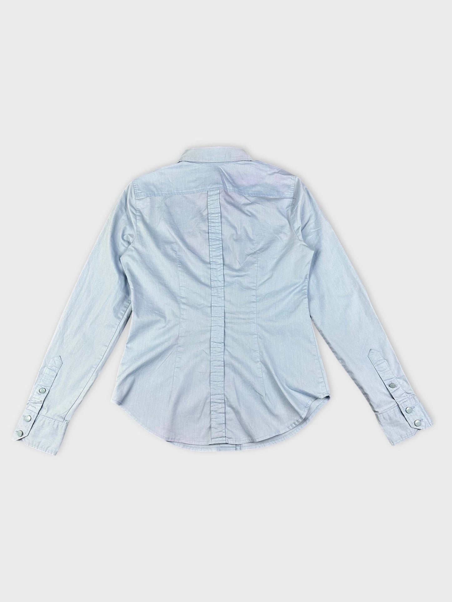 Back view of a sky blue button up shirt with subtle vertical texture.