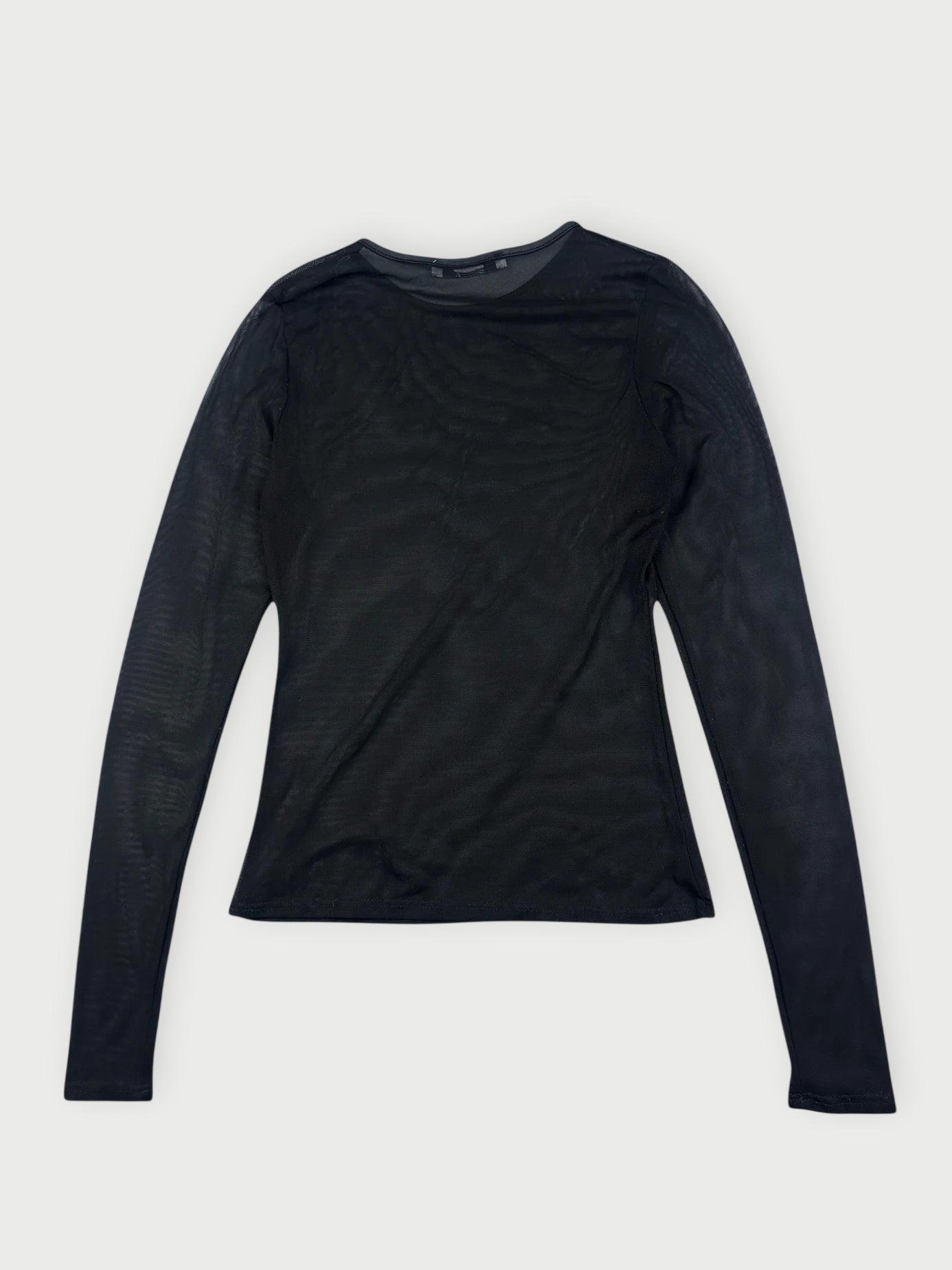 Back view of a sheer black long-sleeve top with a fitted silhouette.