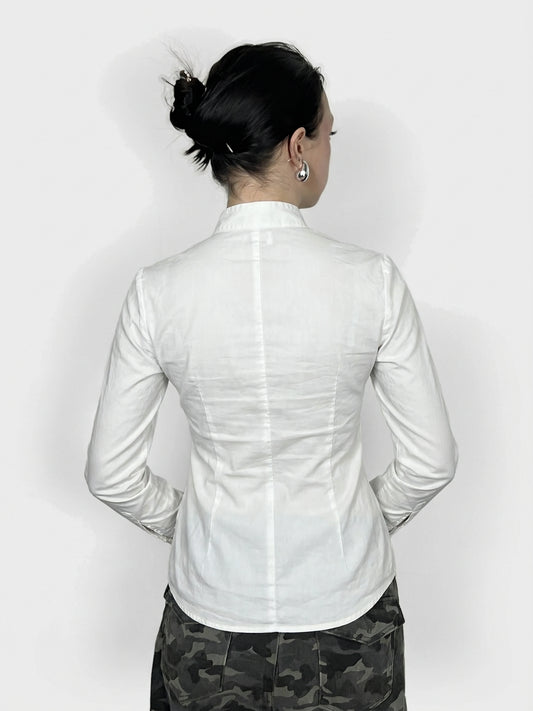 Back view of a sleek white long sleeve button-up with tailored shape.