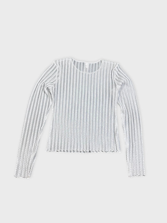 Back view of a white ribbed knit shirt with long sleeves.