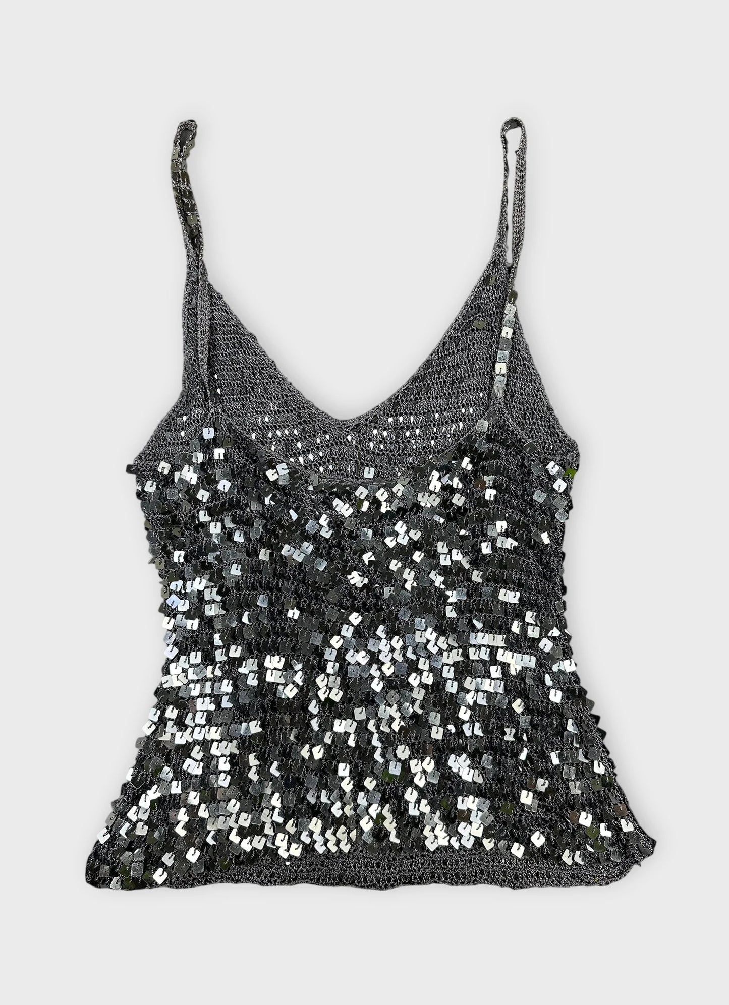 Back view of a sparkly silver crop top with sequins.