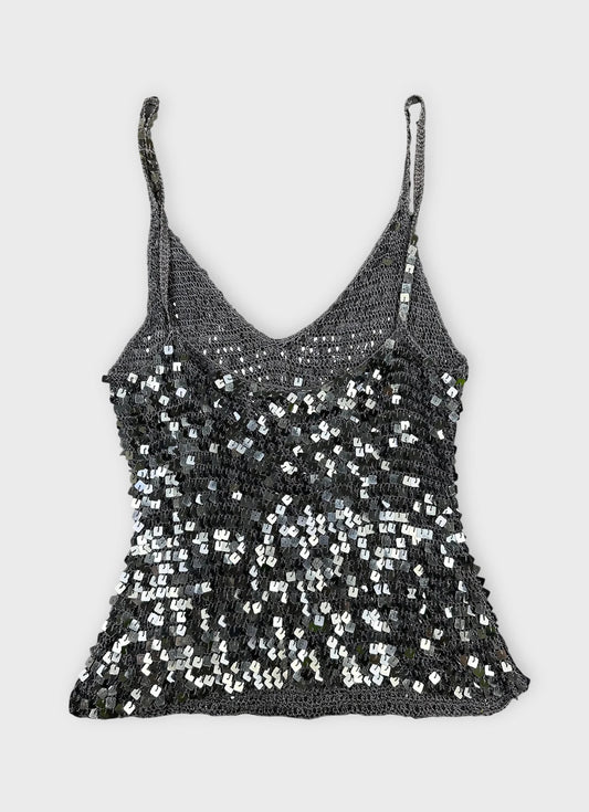 Back view of a sparkly silver crop top with sequins.