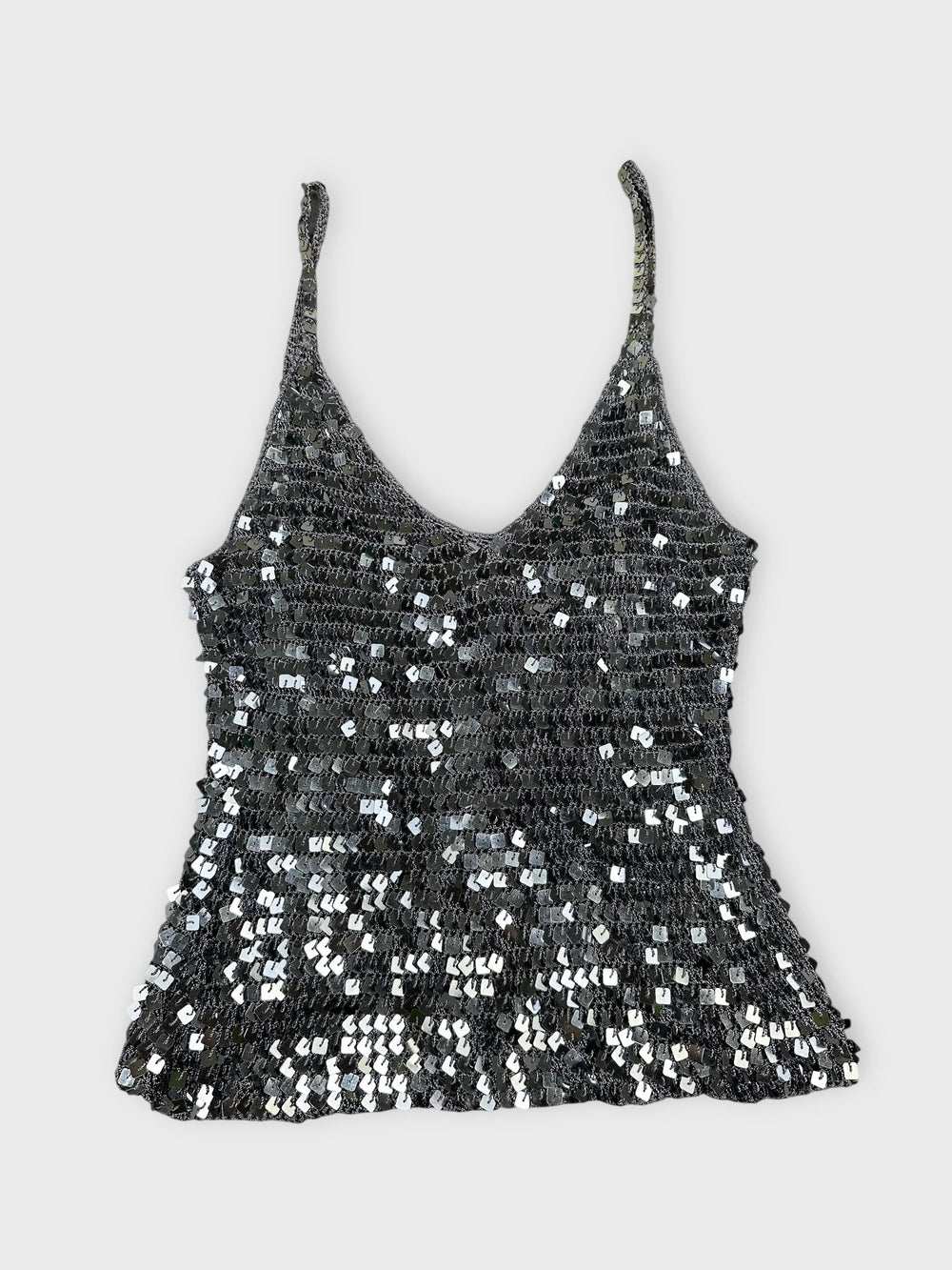 Sparkly silver crop top front view featuring a sequined pattern.