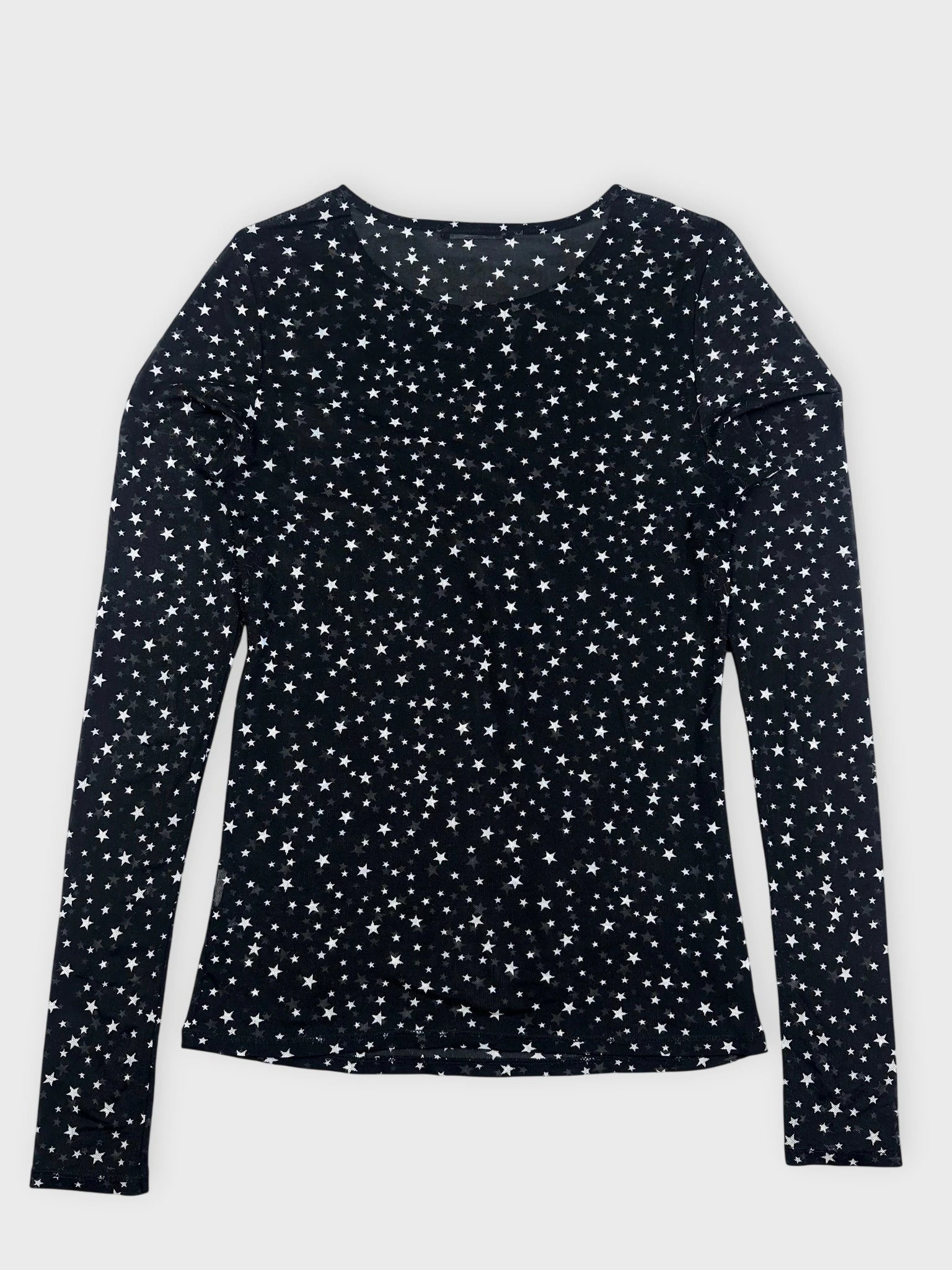 Back view of black long sleeve top featuring a star pattern.