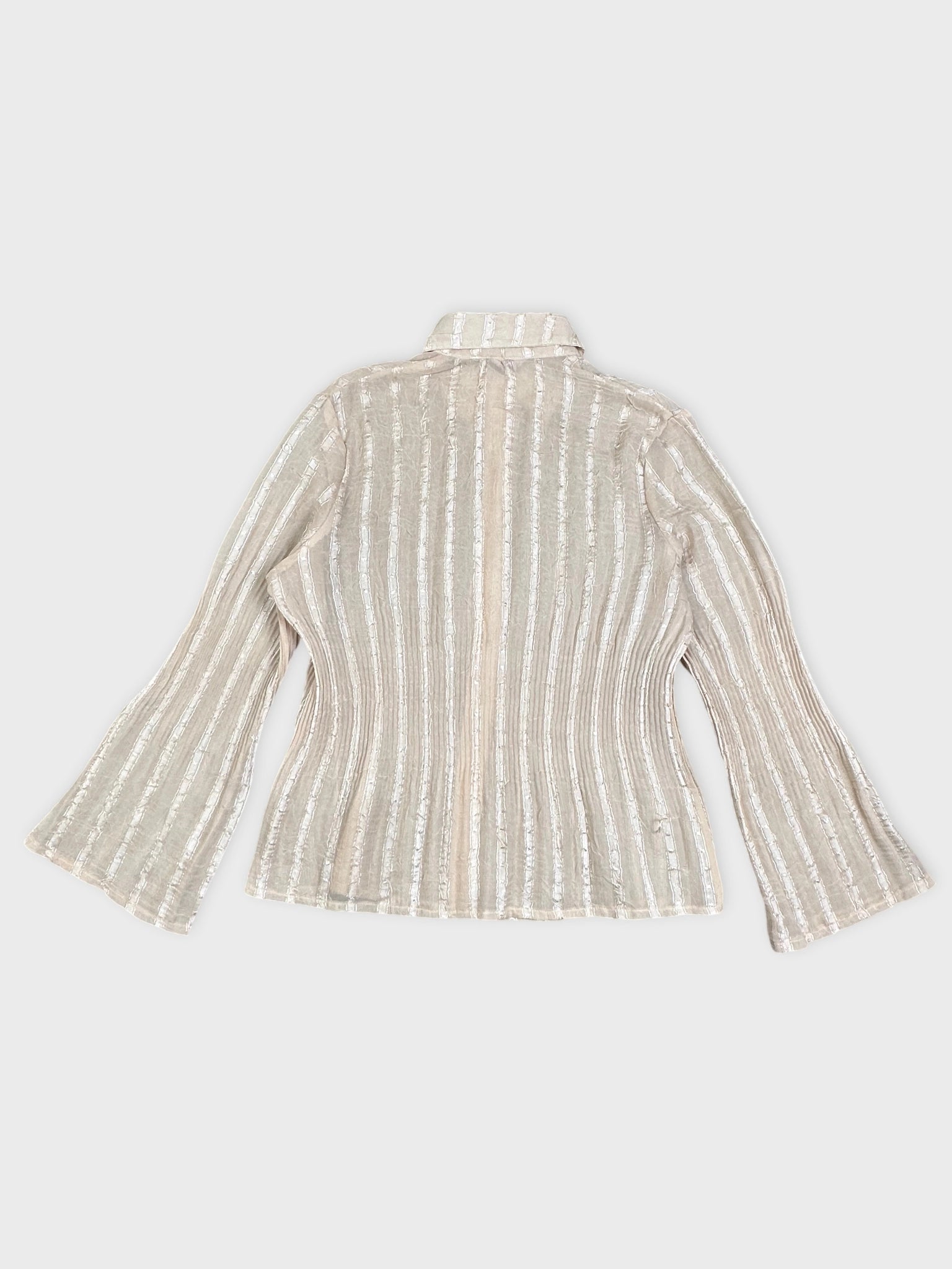 Back view of a cream striped blouse with flared sleeves.
