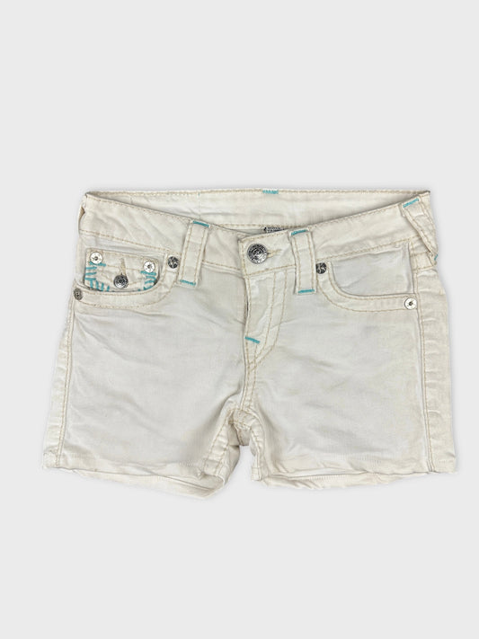 Front view of white denim shorts featuring detailed pocket design.
