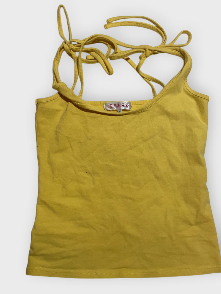 Detail view of a sunshine yellow tie-shoulder tank top with ribbon straps.
