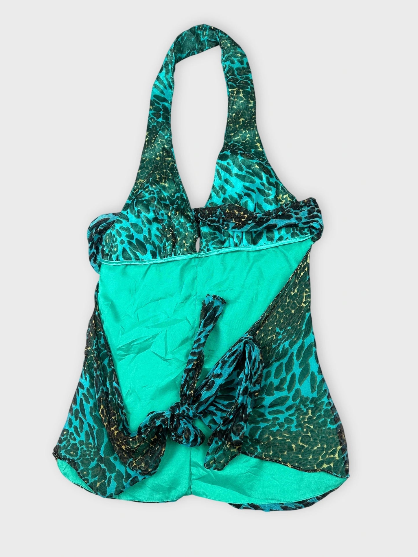 Teal leopard print top with ruched detail view from above.