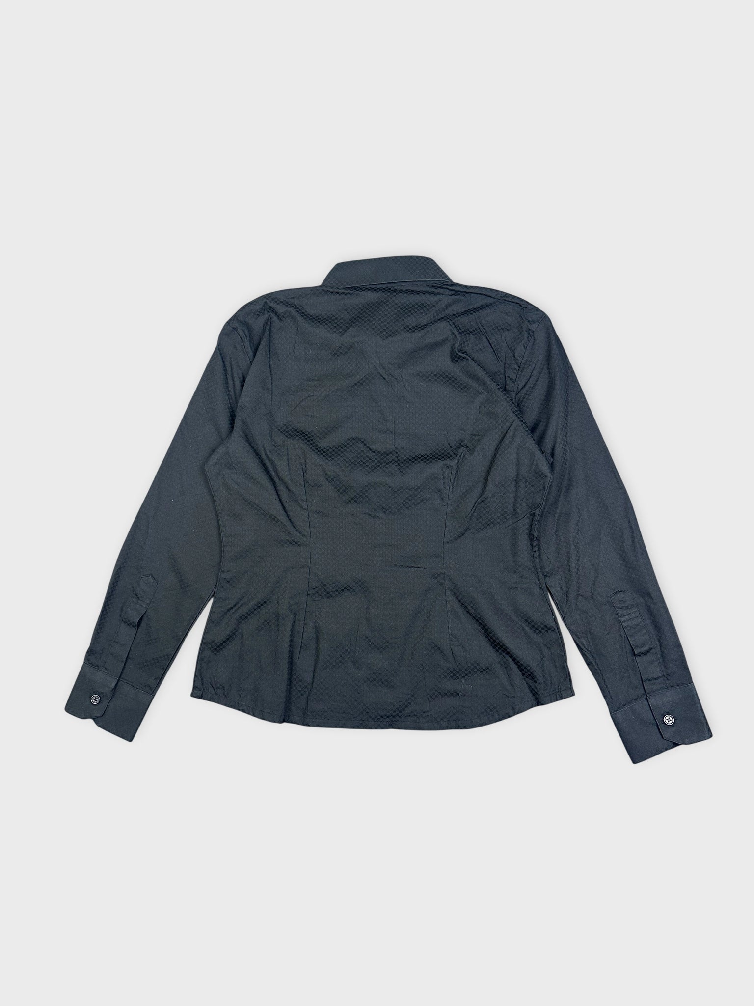 Back view of a black textured shirt featuring fitted design and button details.