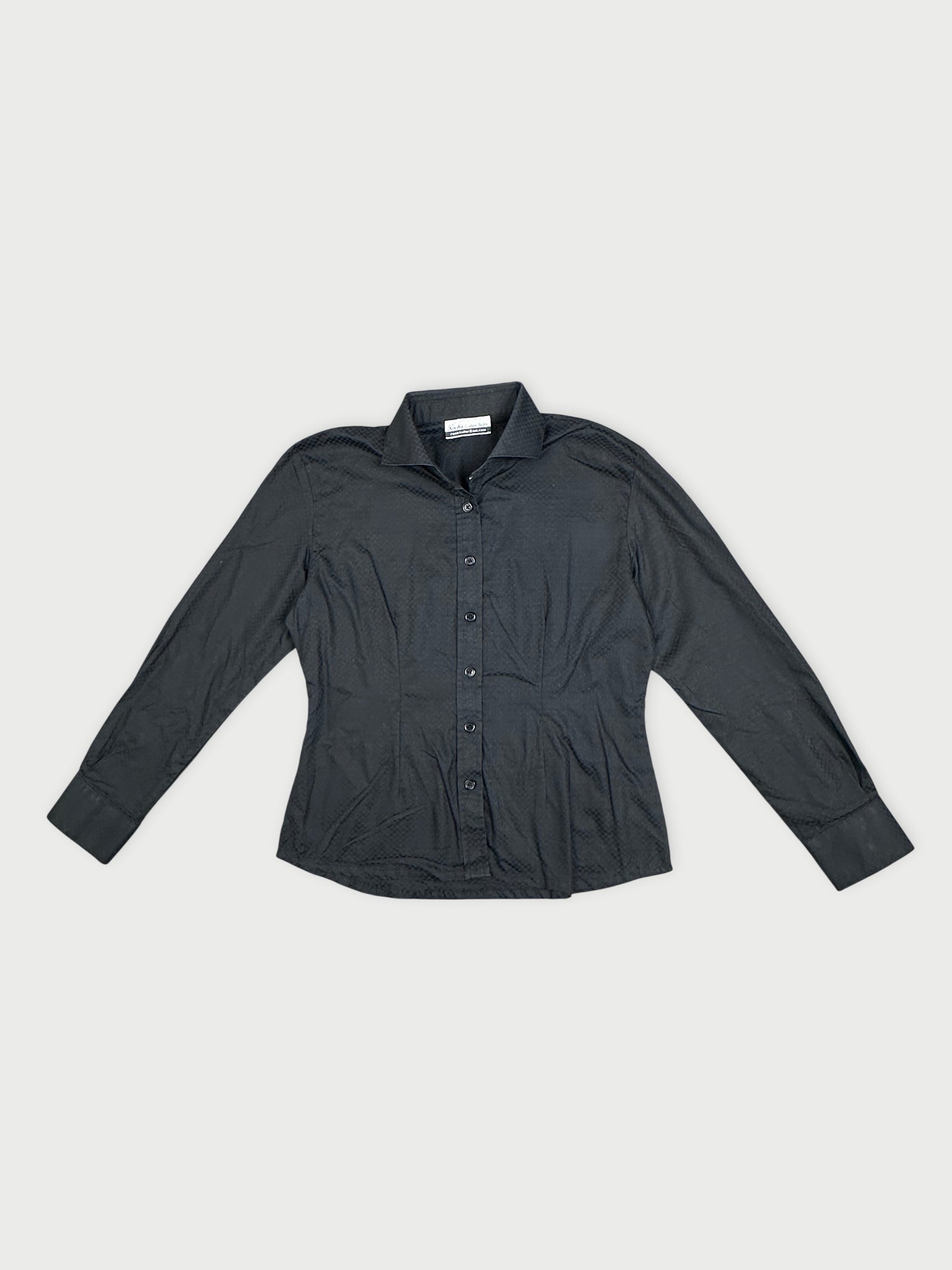 Black long-sleeve shirt with textured fabric, front view.