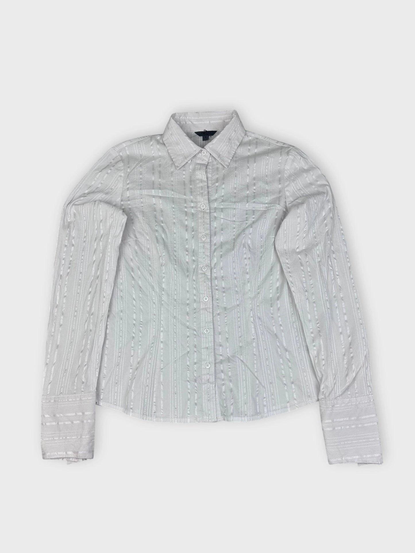 Textured white button-up shirt with subtle stripes detail view