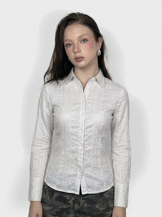 Textured white button-up shirt with subtle pattern, shown in front view.