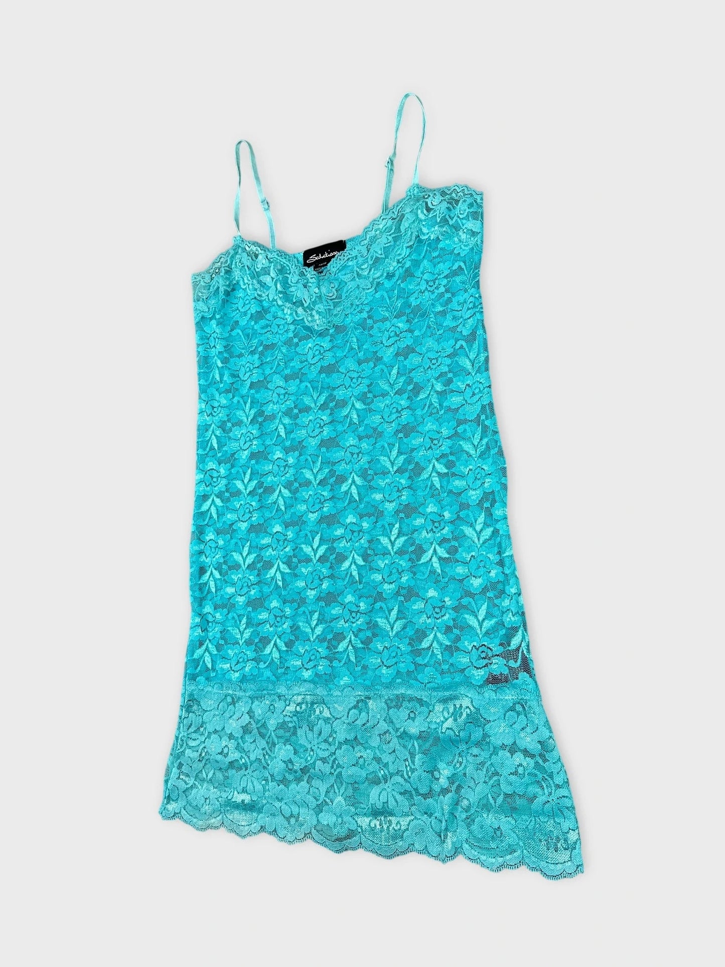 Turquoise lace top with delicate straps in detail view