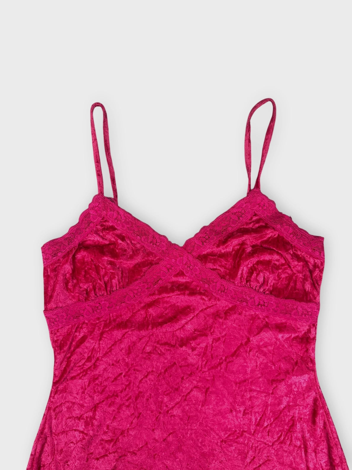 Vibrant fuchsia lace camisole with a crinkled texture detail view