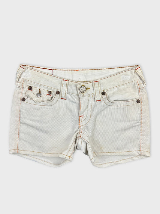 Front view of white denim shorts with edgy orange stitching details.