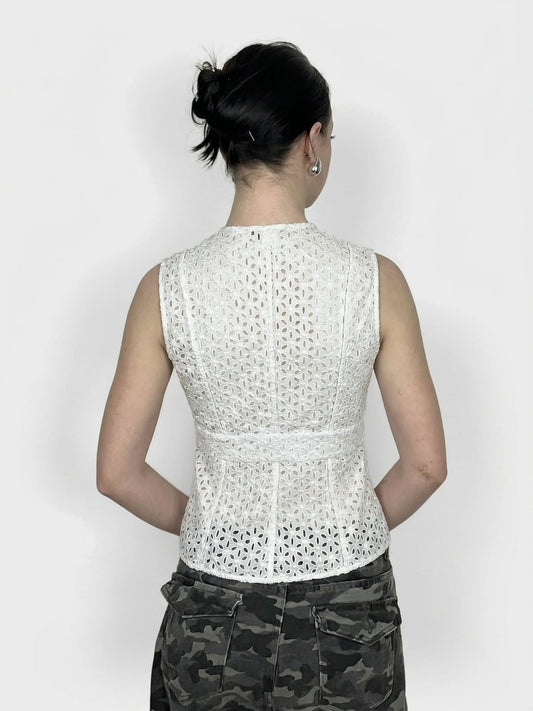 Back view of a white lace crop top featuring a V-neck design.