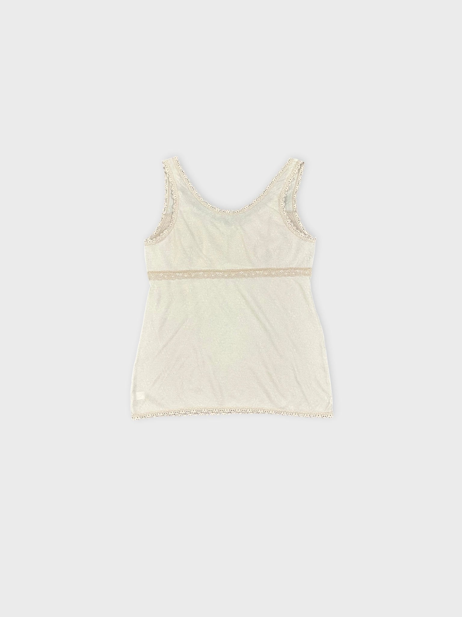 Back view of a white tank top with lace trim detailing.