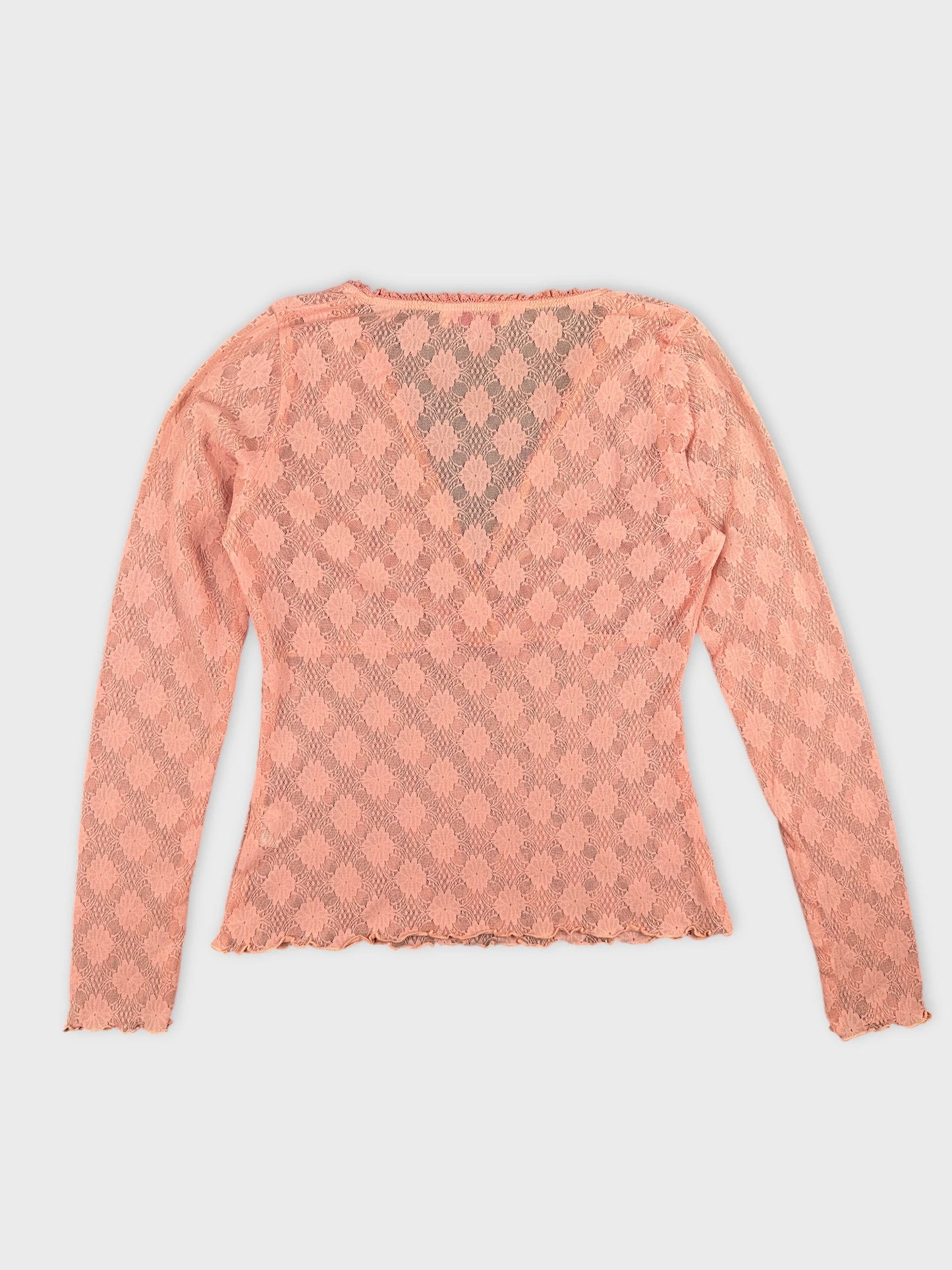 Back view of a pink lace long sleeve body shirt with scalloped hem.