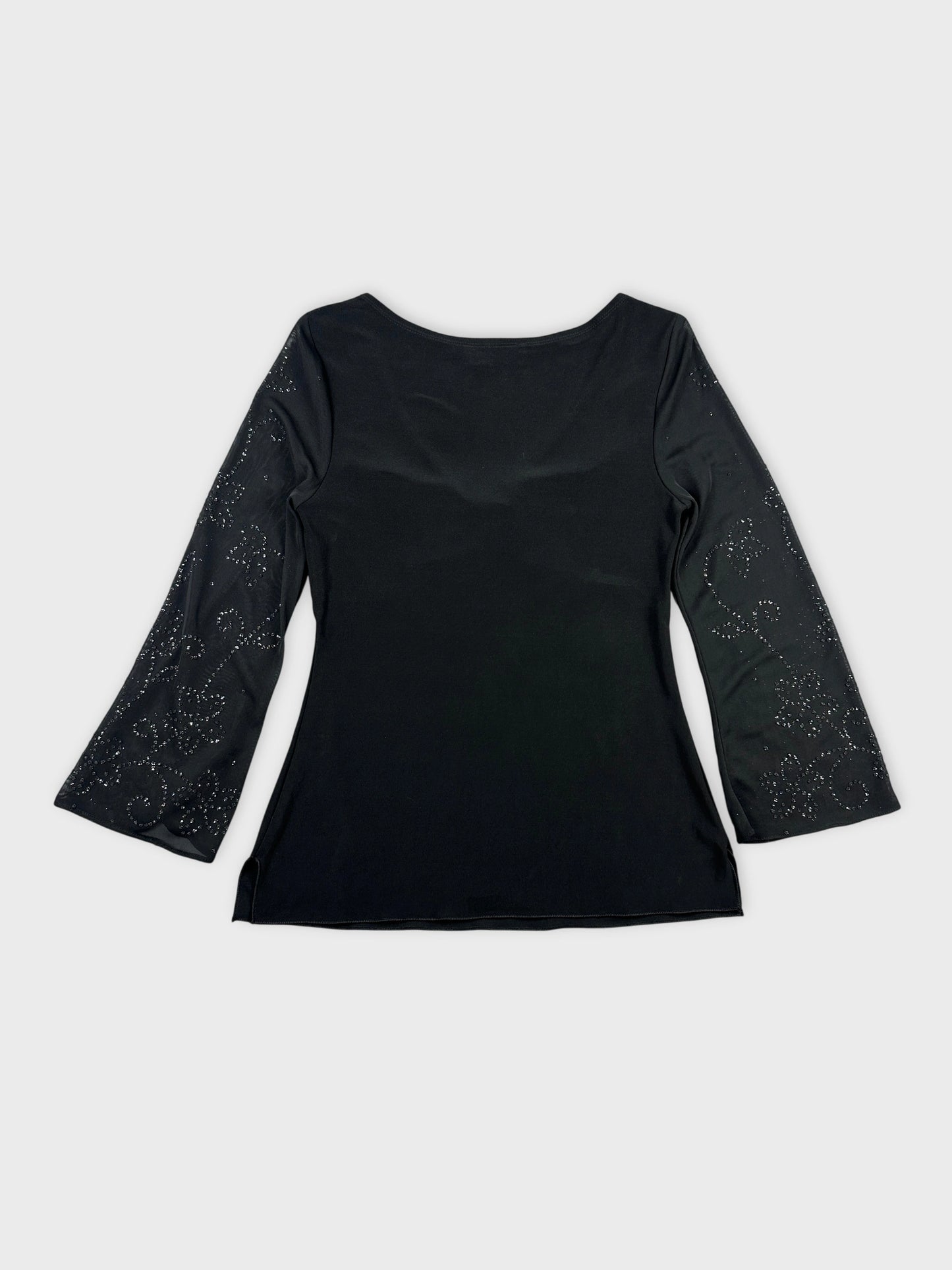 Back view of a black body shirt with intricate detailed sleeves.