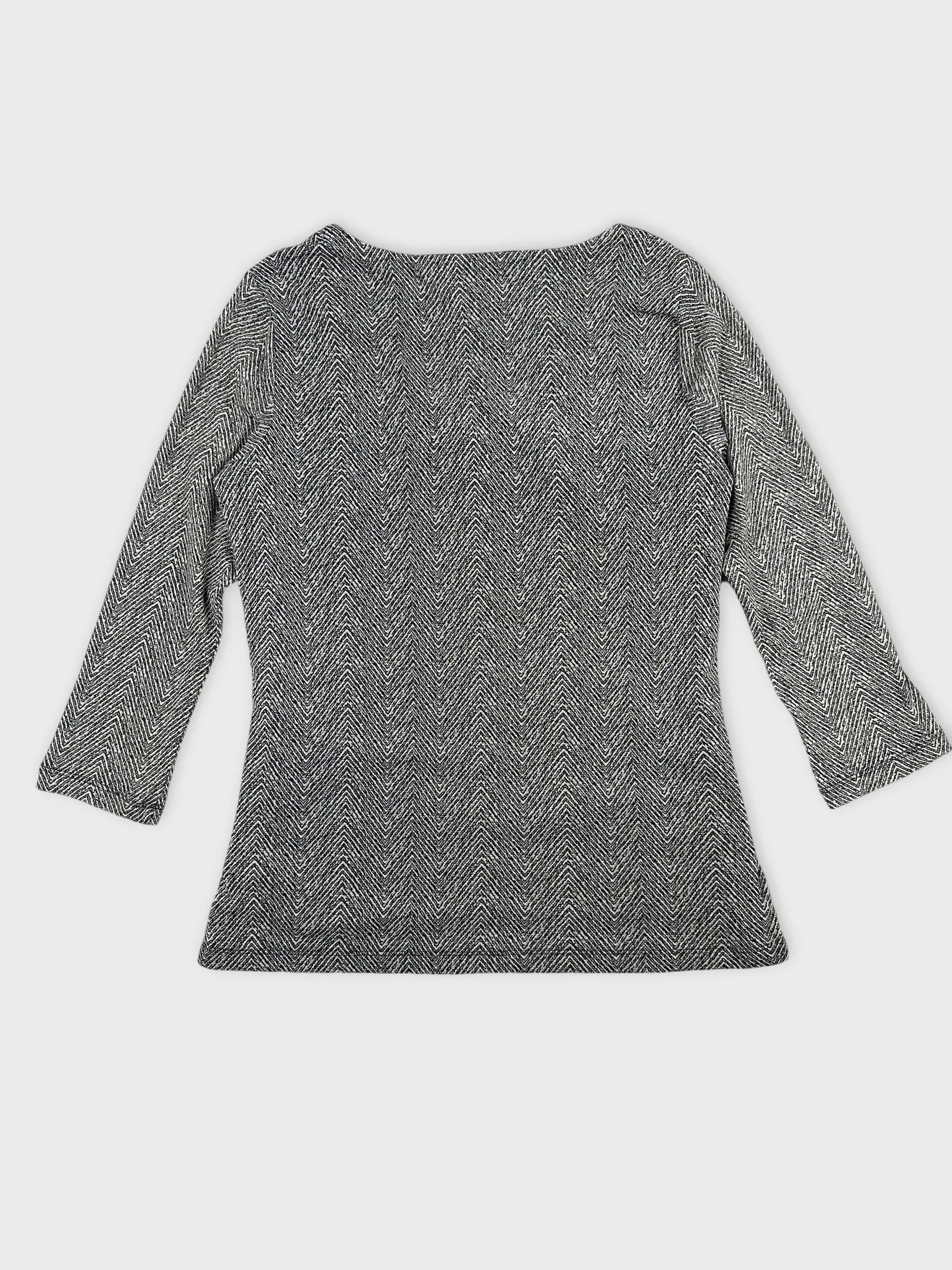 Back view of a women's body shirt in black and white herringbone pattern.