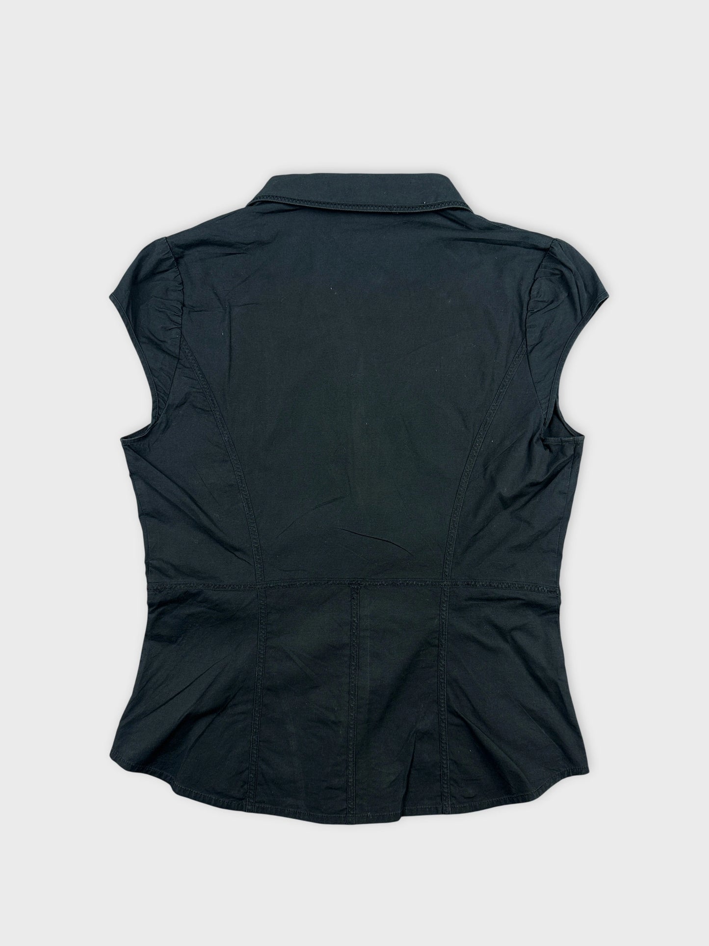 Back view of a black body shirt with cap sleeves and detailed seam lines.