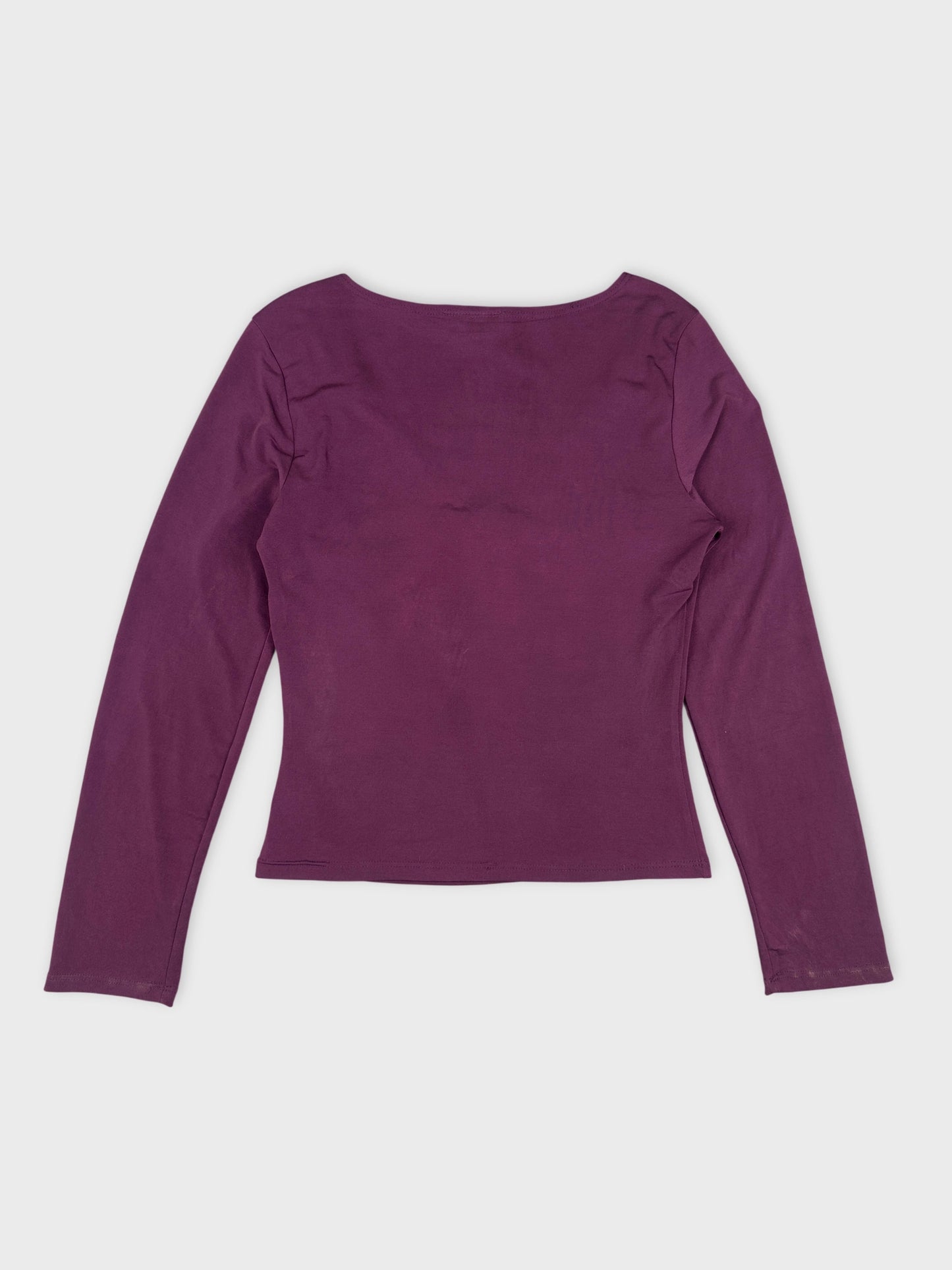Back view of a long-sleeve body shirt in deep purple.