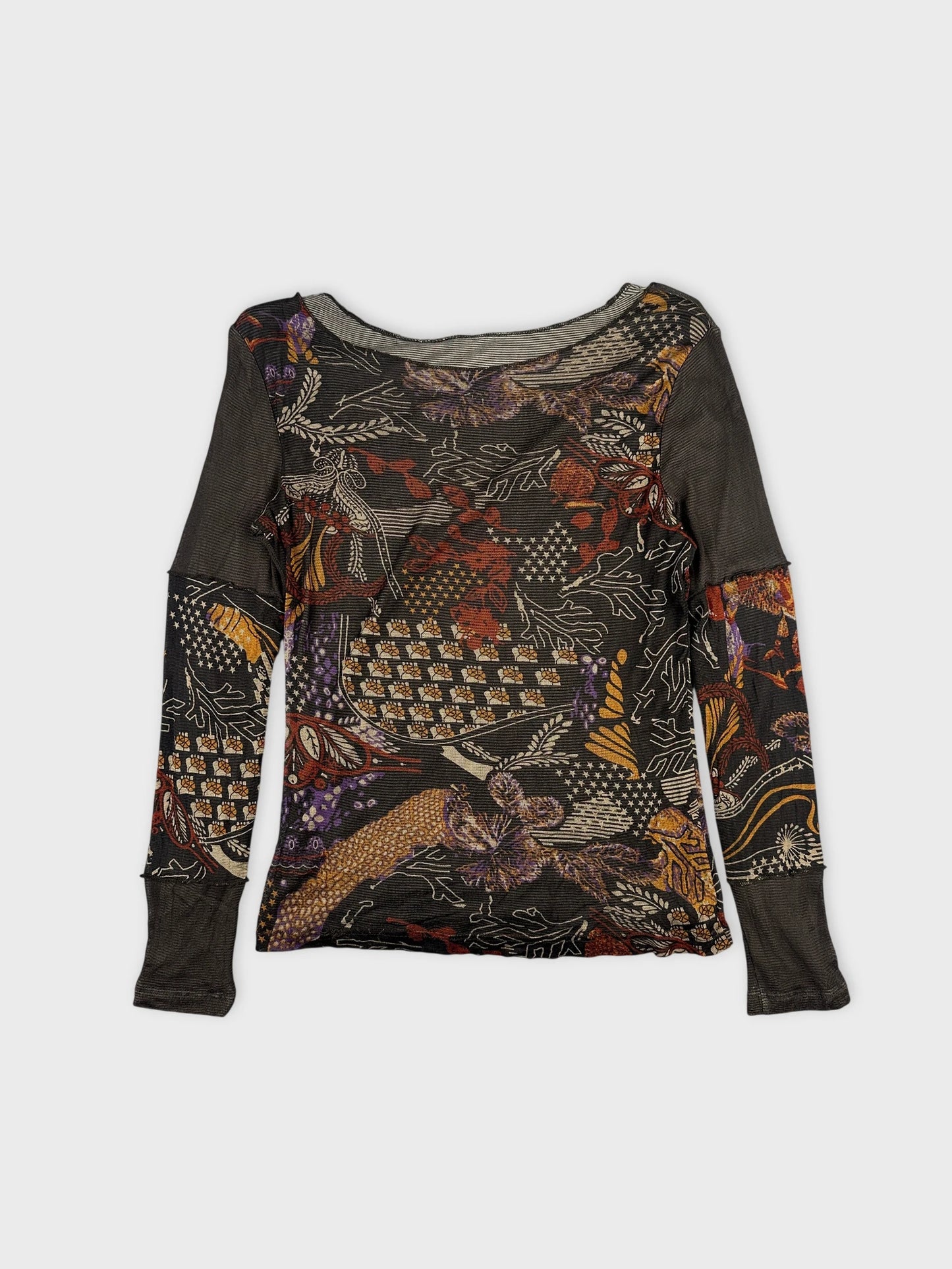 Detail view of a black long-sleeve body shirt with floral pattern.