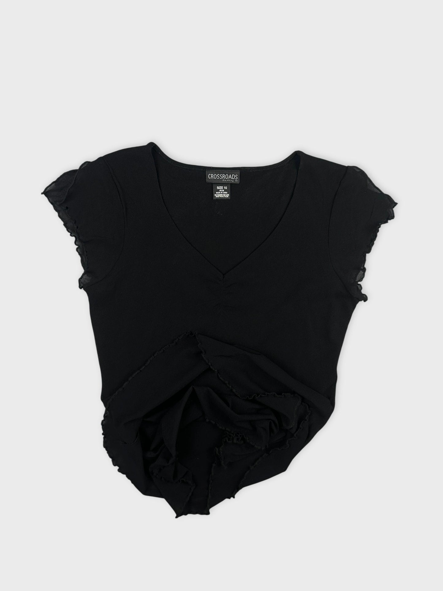 Black body shirt with ruffled sleeves detail view