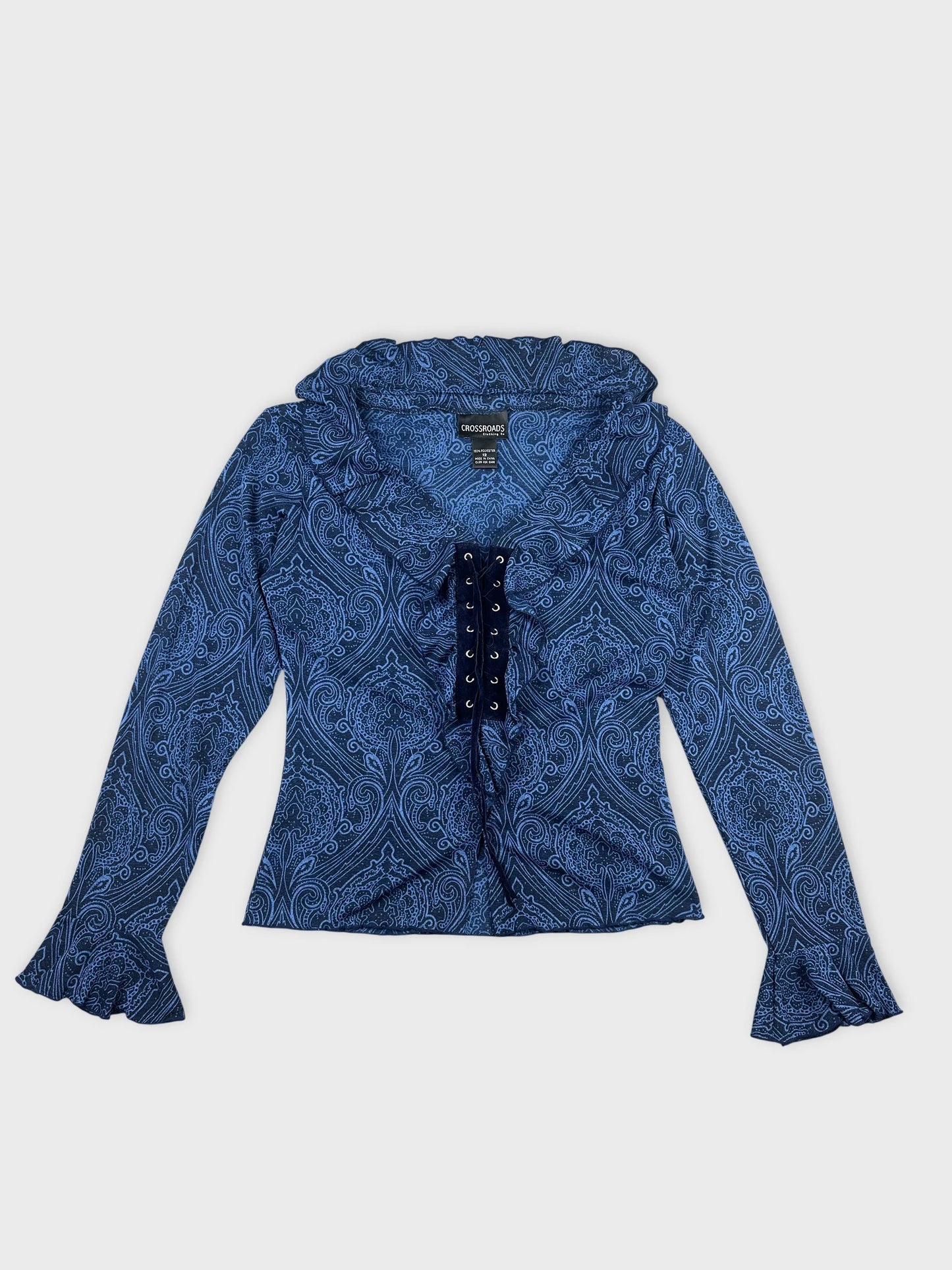 Front view of a blue women's body shirt with paisley pattern and lace-up detail.
