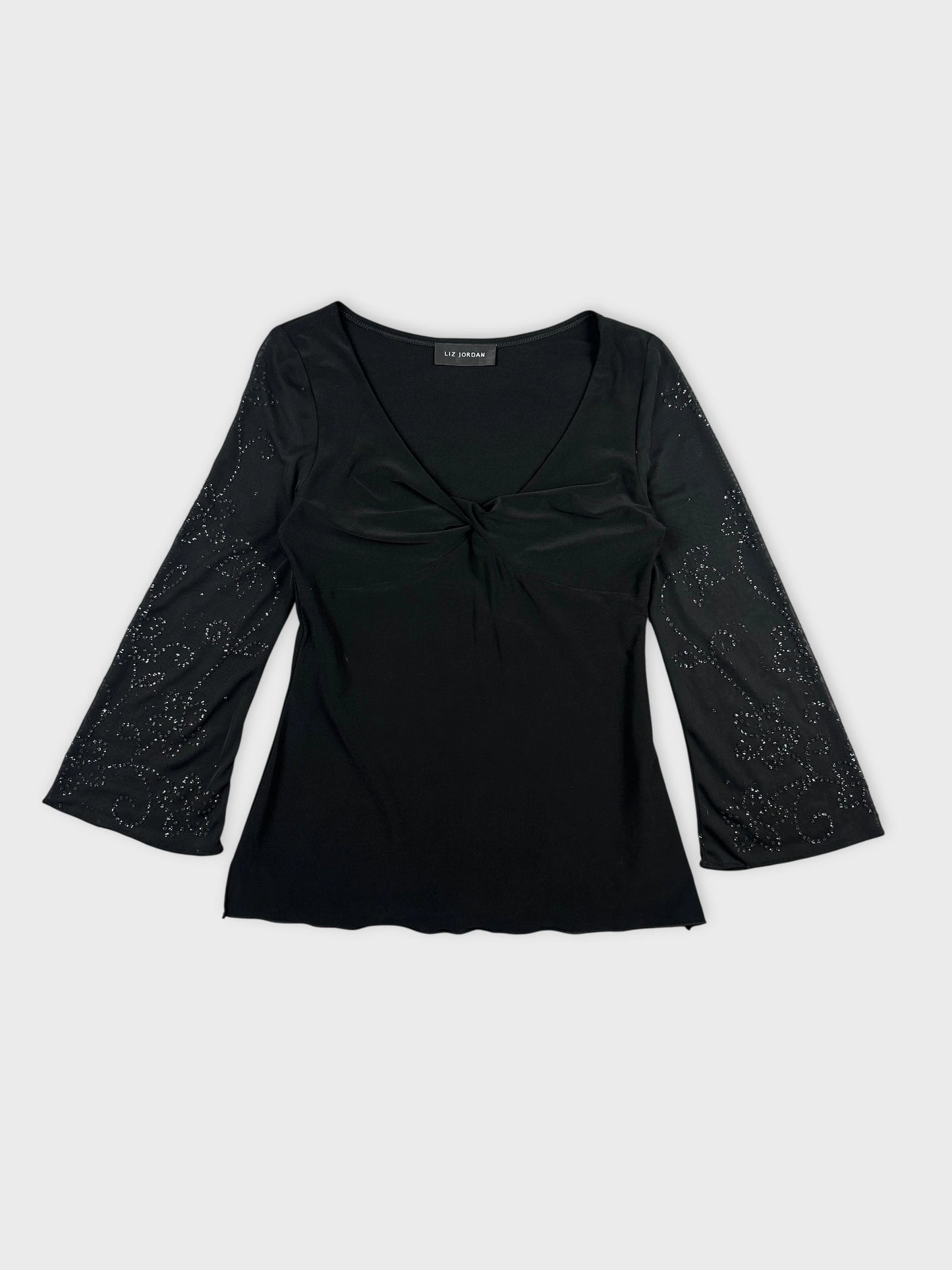 Front view of a black body shirt with embellished bell sleeves.
