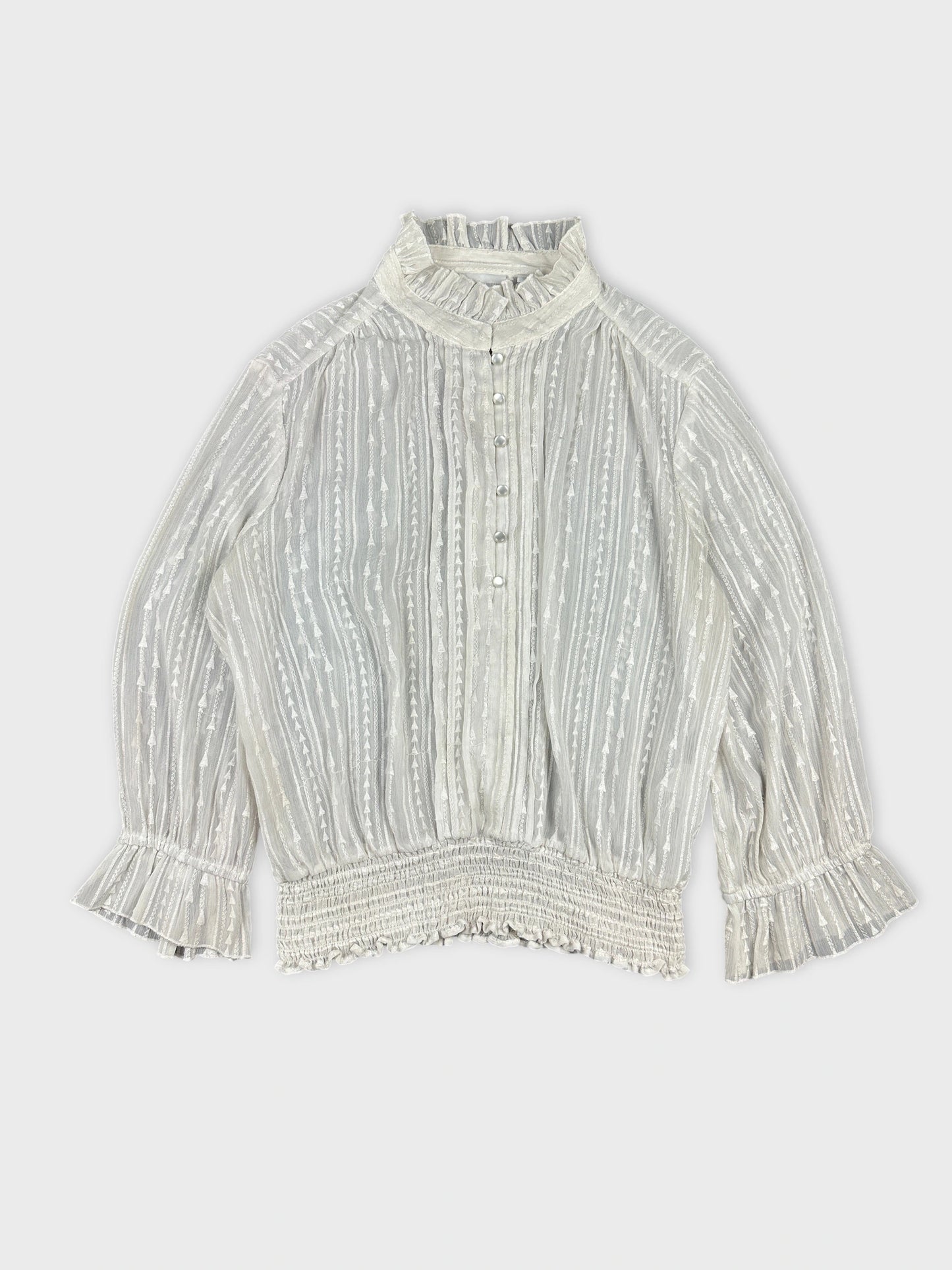 Front view of a vintage women body shirt in light gray with ruffled trim.