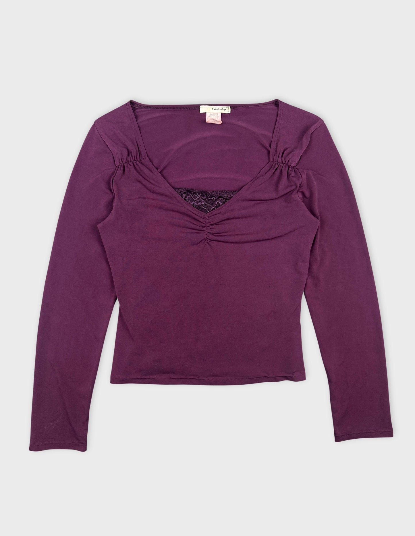 Front view of a purple body shirt featuring gathered detailing along the neckline.