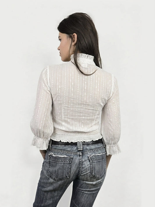 Back view of a white body shirt with subtle vertical stripes and ruffled cuffs.