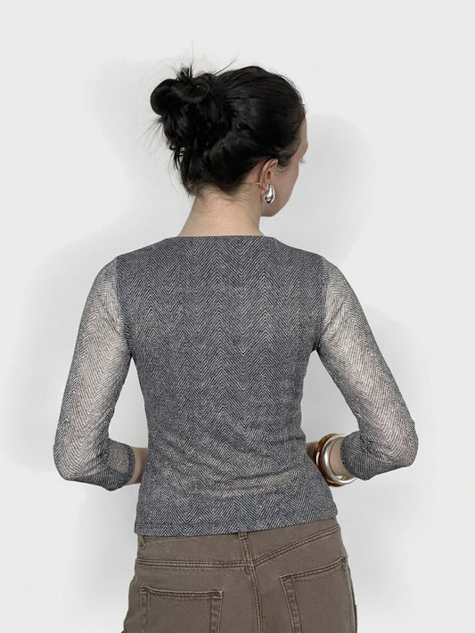 Back view of a women's body shirt in gray with herringbone pattern.