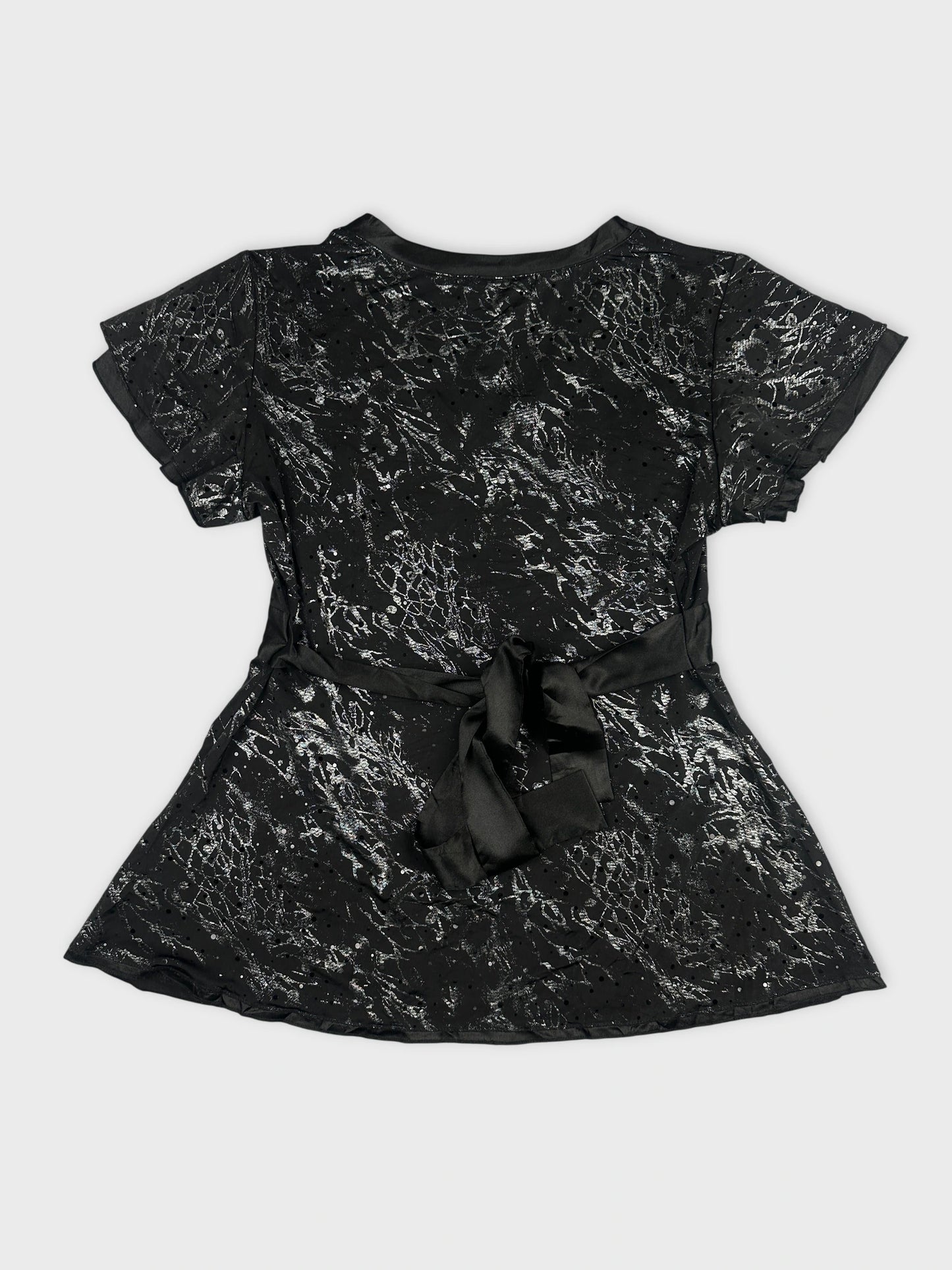 Back view of a black women’s body shirt with a satin bow detail.