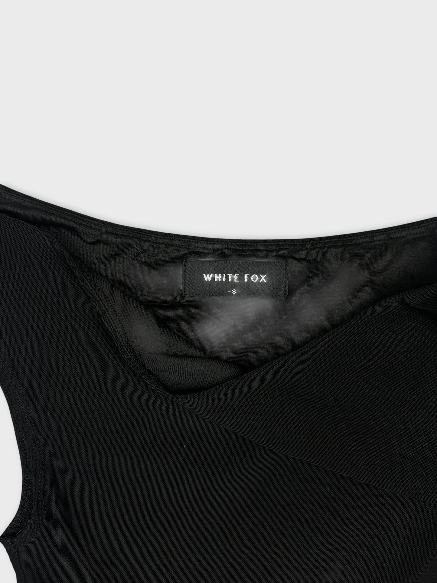 Back view of a black body shirt featuring a scoop neckline.