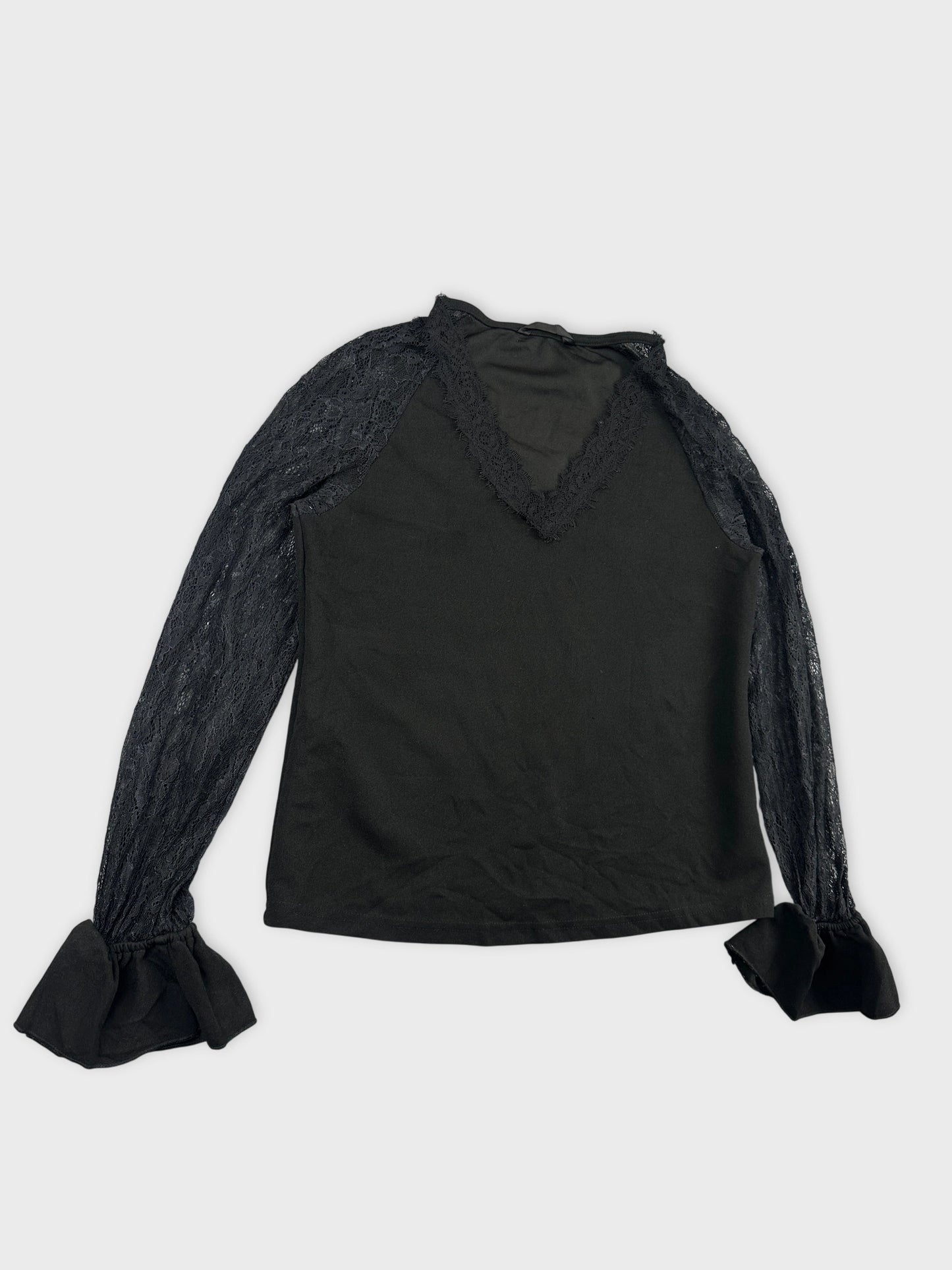 Detail view of a black body shirt featuring lace sleeves and ruffled cuffs.