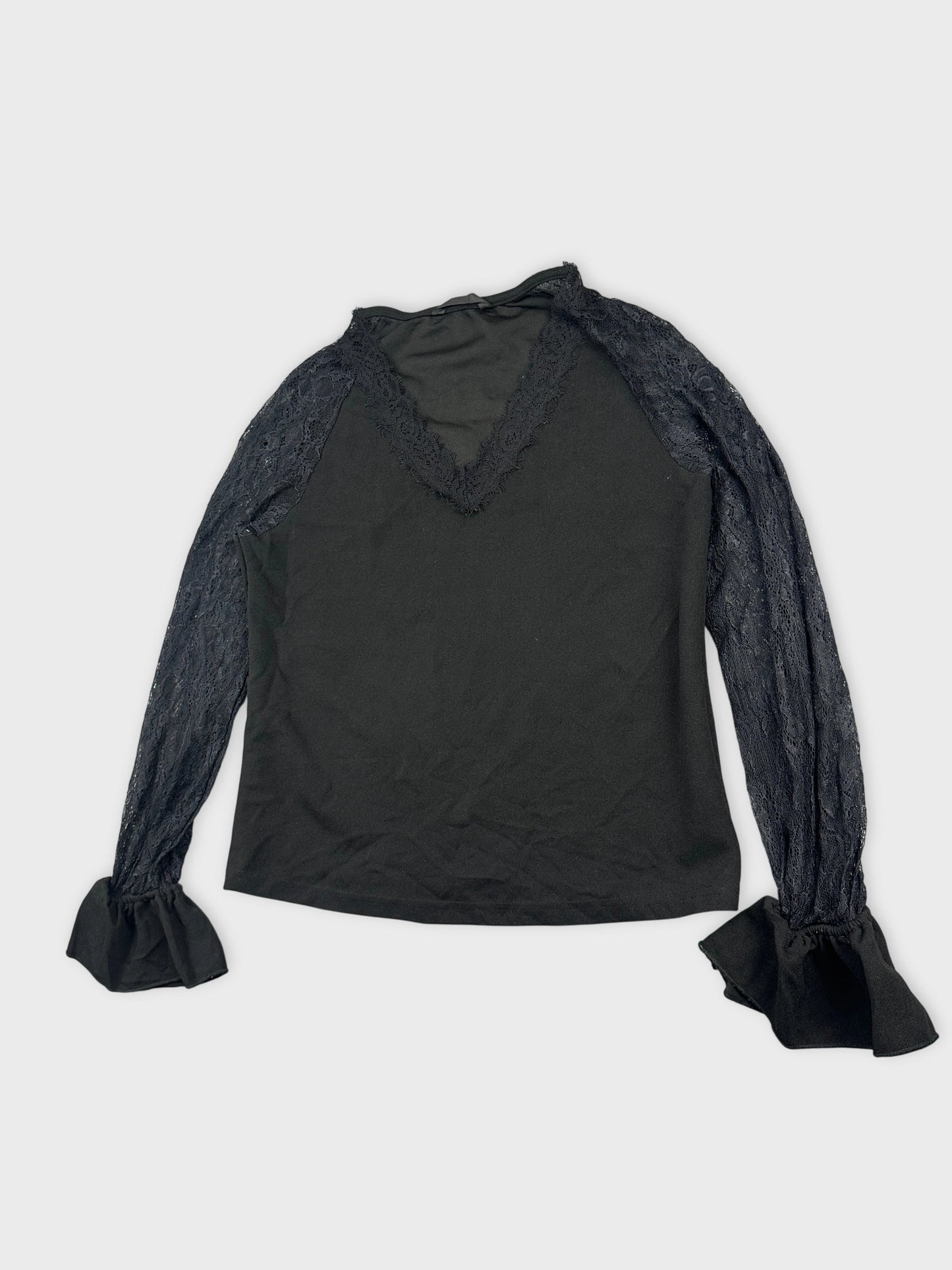 Detail view of a black body shirt featuring lace sleeves and trim.