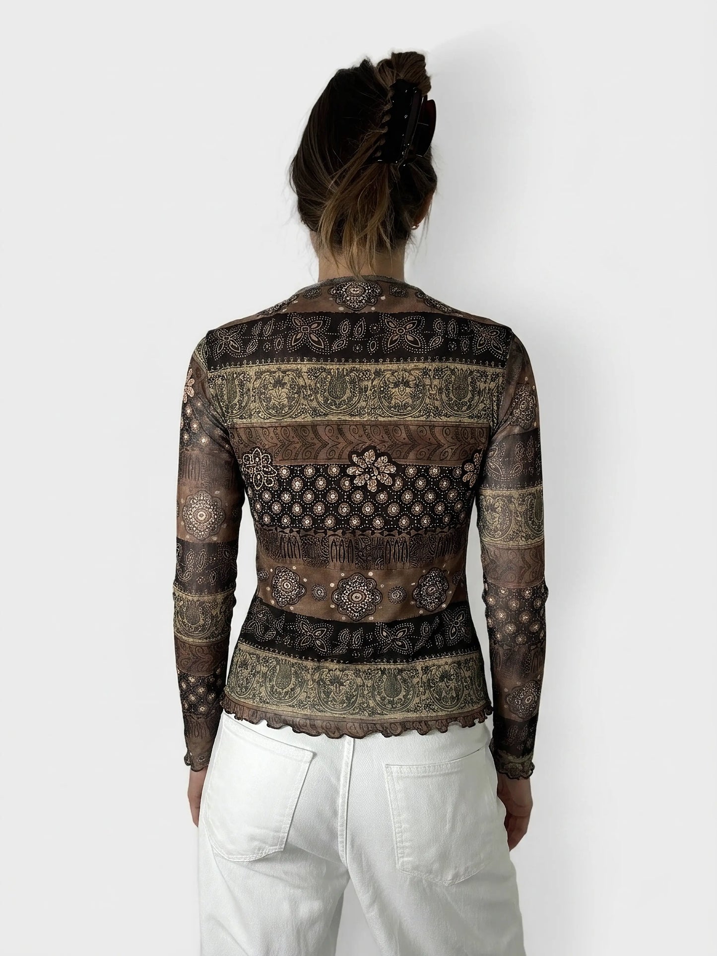 Back view of a brown long-sleeve shirt with intricate patterns and a scalloped hem.
