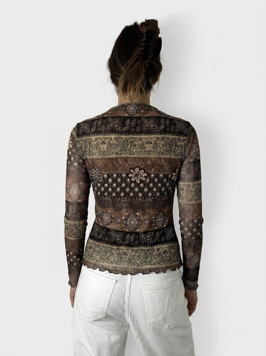 Back view of a brown long-sleeve shirt with intricate patterns and a scalloped hem.