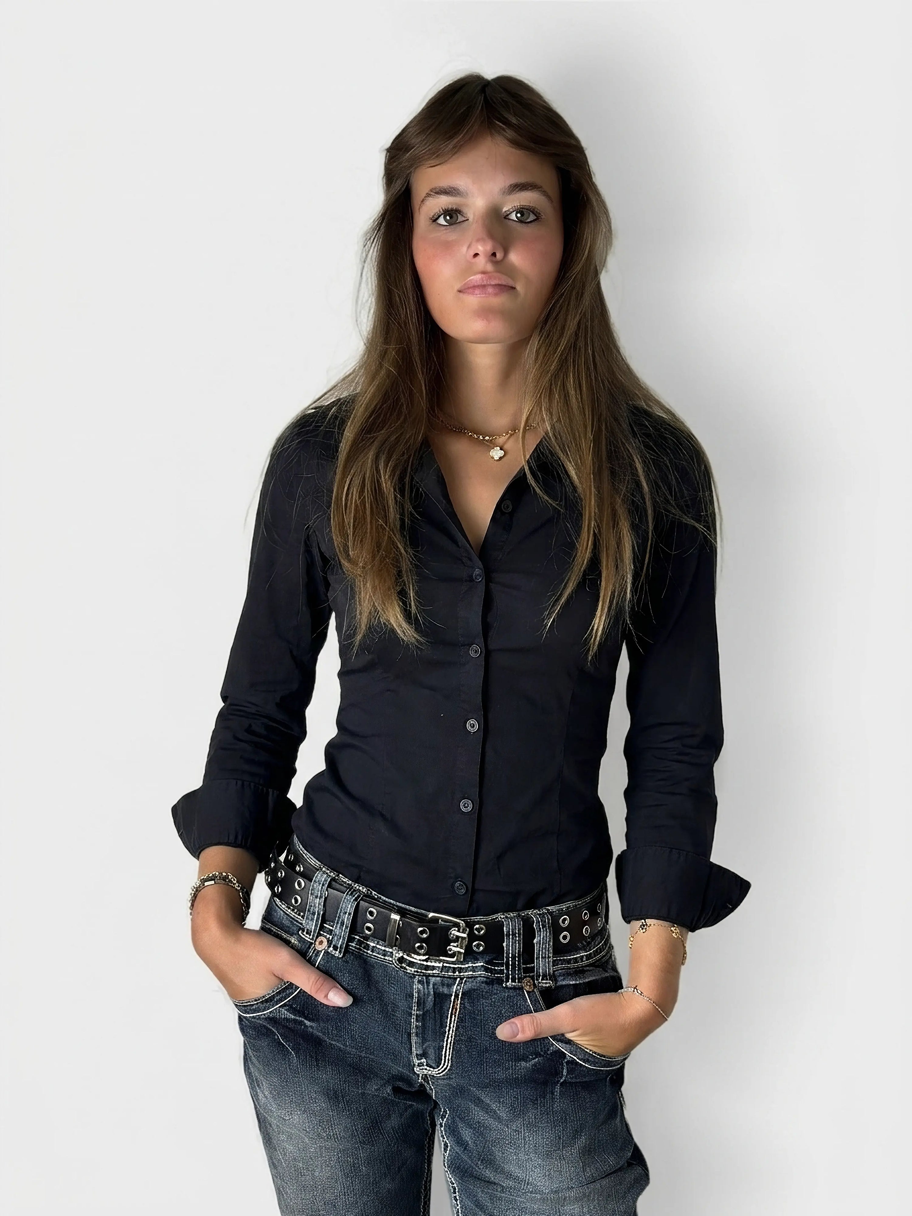 Front view of a black body shirt with a button-up design.