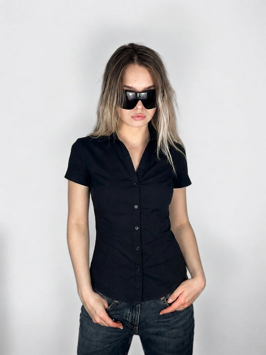 Black body shirt featuring a button-down front view.