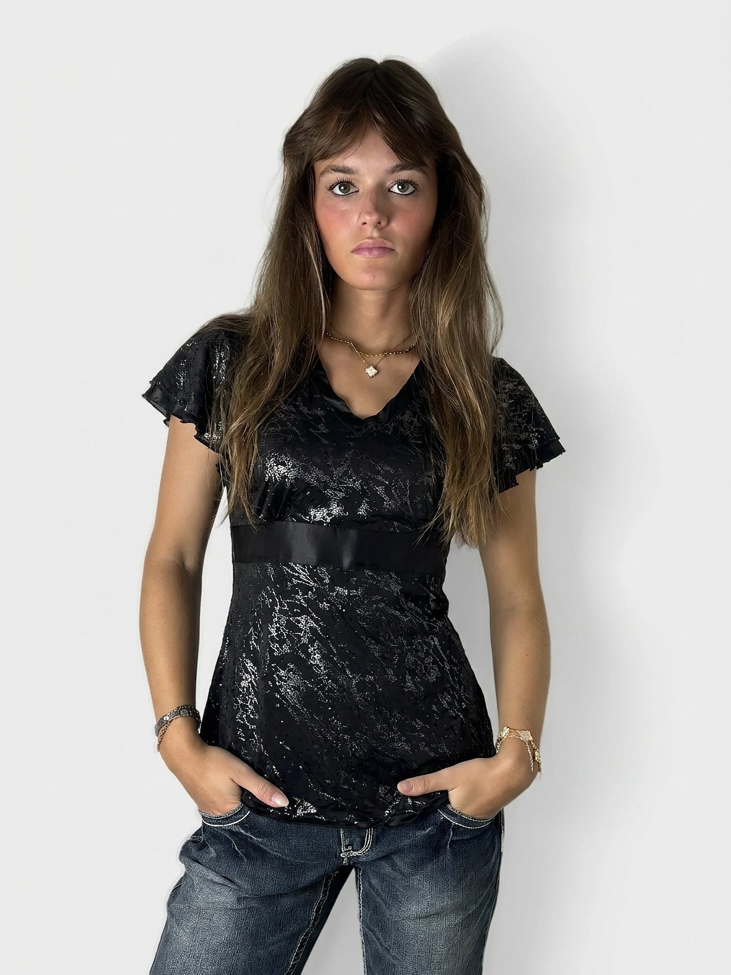Black body shirt with lace detail, front view.