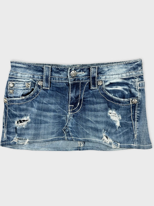 Front view of blue distressed denim body shorts with silver button detailing.