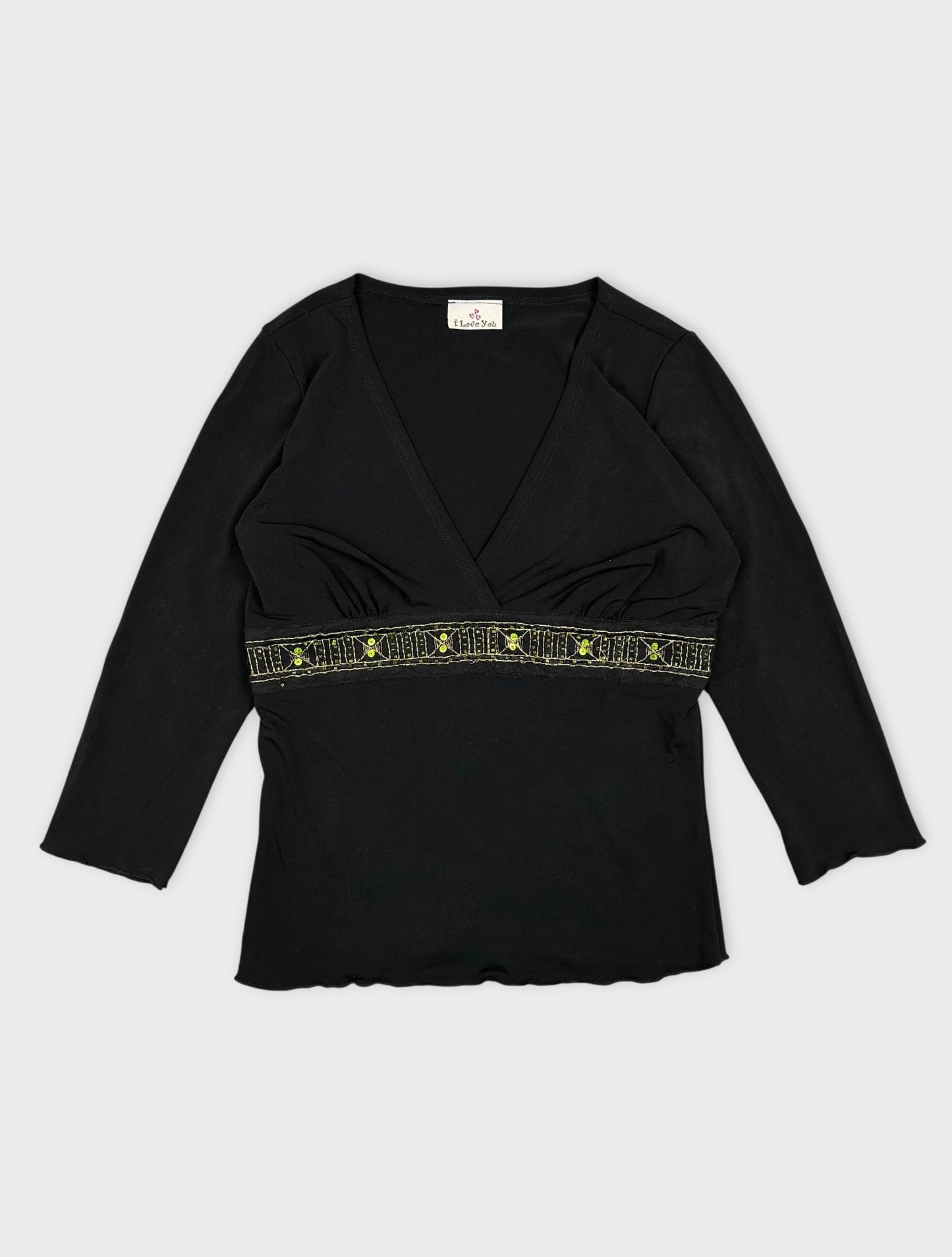 Black body T-shirt with a decorative green patterned band front view
