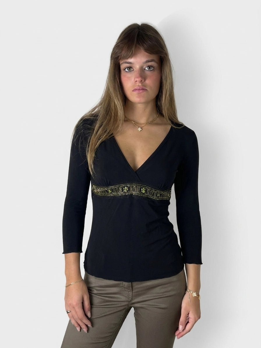 Women’s black body t-shirt with green decorative trim, front view.