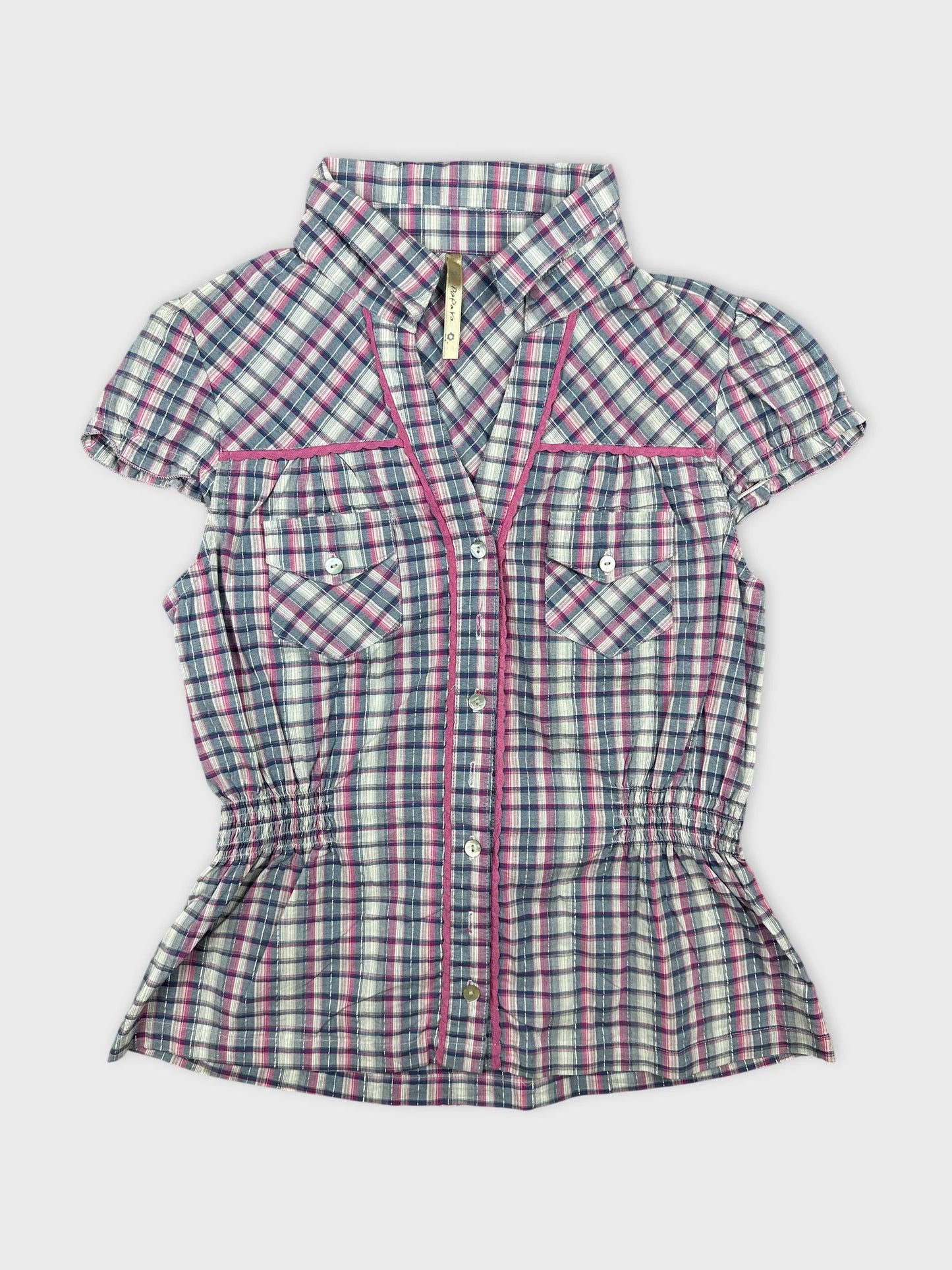 Front view of a short-sleeve plaid shirt with pink trim and buttons.