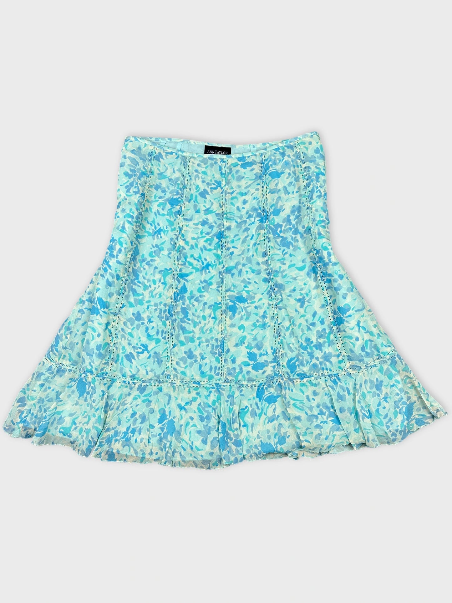 Front view of a flared dress in light blue floral print.